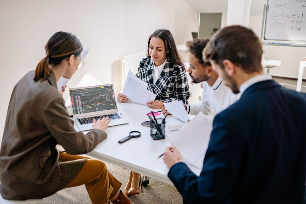 A team reviewing a laptop with search and performance data