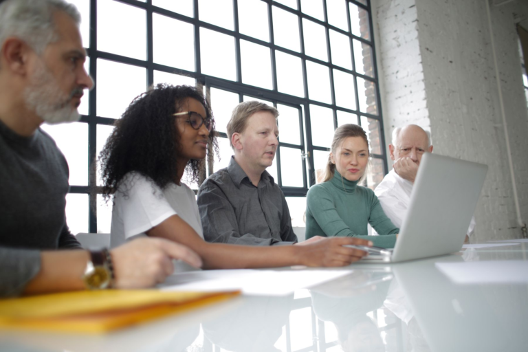 Colleagues working together on a website project in a modern office